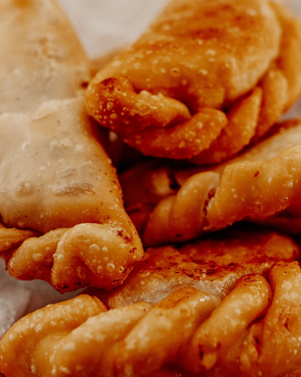 A plate of freshly fried Argentine empanadas (representative photograph, not Señor Tango's own menu)